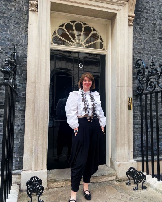 Lucy Littlewood outside the door of 10 Downing Street.